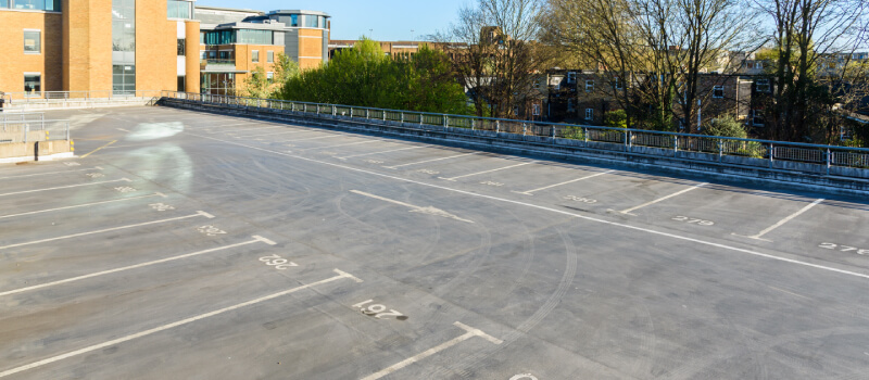 Empty car park with lots of marked bays