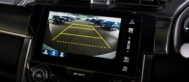 Reversing camera screen in car showing guide lines