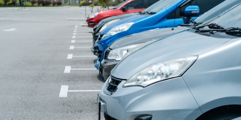 Row of cars parked in marked bays